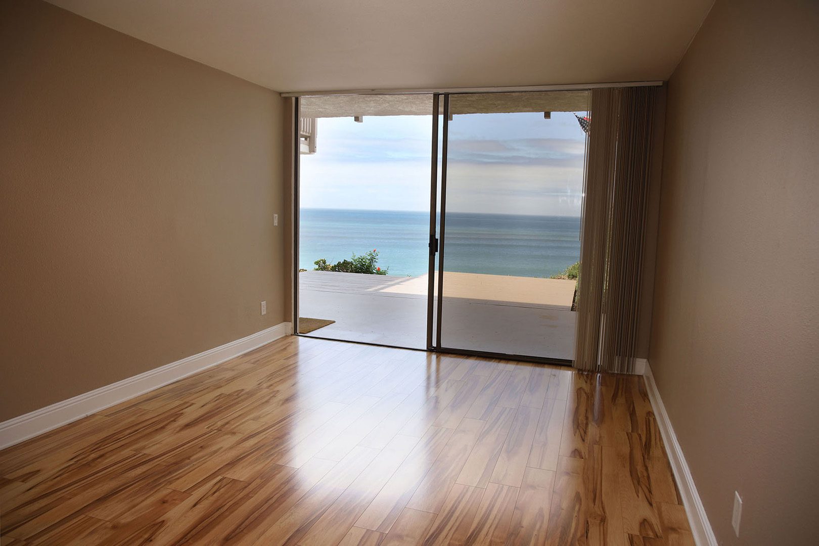 bedroom with view of ocean